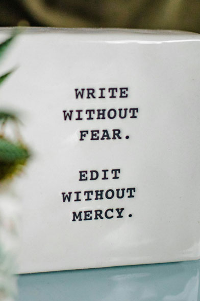 Photo of a paperweight with a motivational inscription.