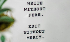 Close up photo of a paperweight with a motivational inscription.